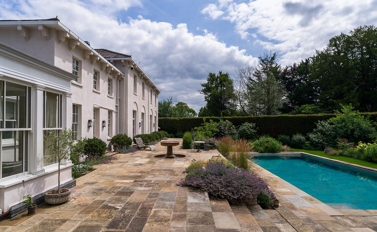 Classic water feature design which utilies reclaimed elements acts a focal point on upper terrace